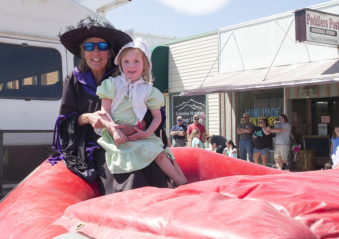 Nancy Lundgren and young friend on the Great Northern float.