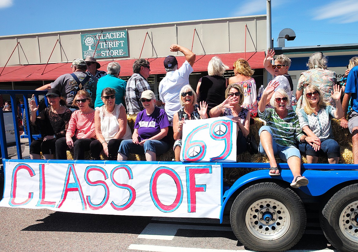 The Class of &#146;69 waves to the crowd.