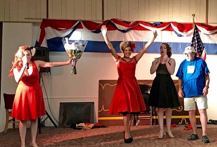 Photo courtesy of SHARON HOWARD
From left: Pin-Ups Julia (creator), Alicia and Becky have some fun on stage with Wallace Elks Exalted Ruler and U.S. Navy veteran Tommy Hayes.