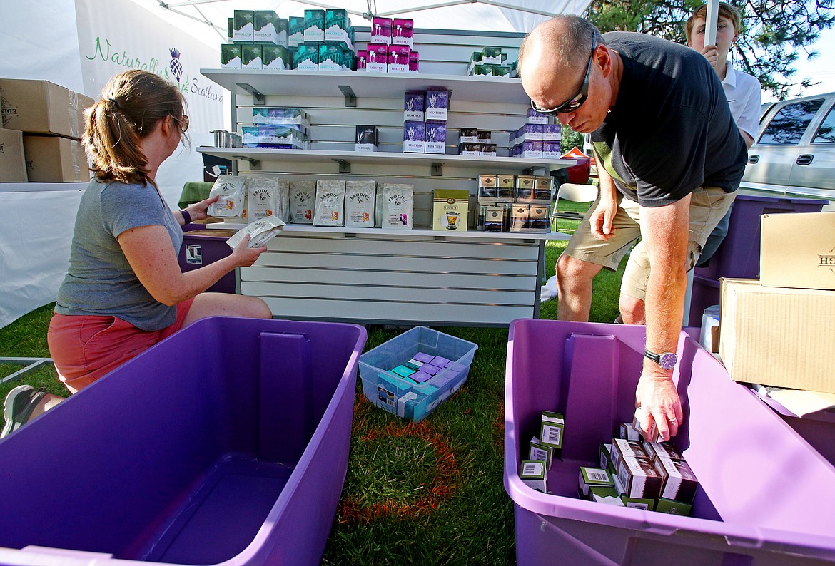 LOREN BENOIT/Press
Andrew and Tracy Begg, of Hayden, set up their Naturally Scotland LLC Booth Friday prior to Rathdrum Days this weekend. The Beggs sell an assortment of teas they purchase themselves when they go to Scotland. Prices range from $3 to $11.