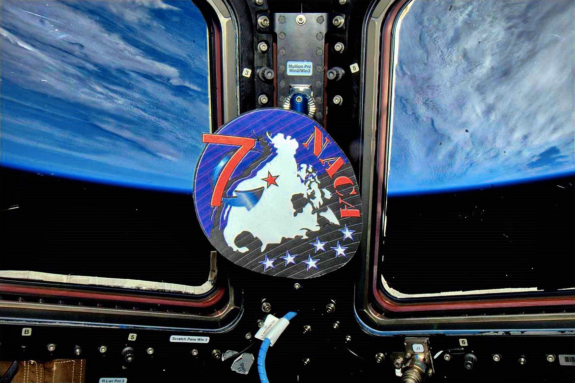 (Photos courtesy, NASA and DR. STEVE SWANSON)
Dr. Steve Swanson, astronaut in residence at Boise State, shared this photo of the NACA classroom logo. It was an appreciated surprise to the class that their pride and joy has flown in orbit above the earth.