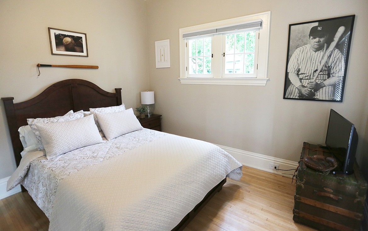 The &#147;Baseball Room&#148; inside Ryan and Mandy Nelson&#146;s Kalispell home features an image of Babe Ruth, whose doctor once owned the home. The room also has a vintage baseball bat, glove, and steamtrunk.