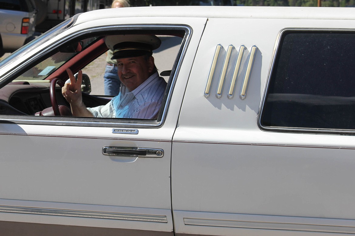 Mineral County Commissioner Roman Zylawy drives a limousine in the parade. (Maggie Dresser/Mineral Independent)