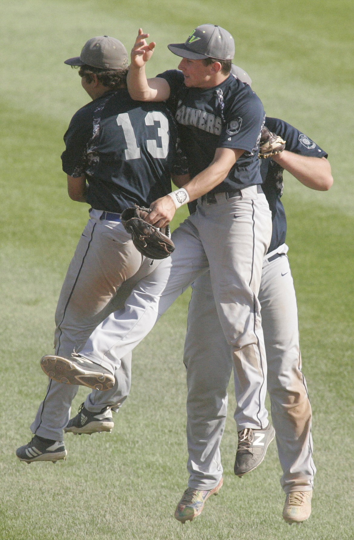 Mariners celebrate come from behind win to defeat Glacier Twins 10-7 July 19. (Photo by Paul Sievers)