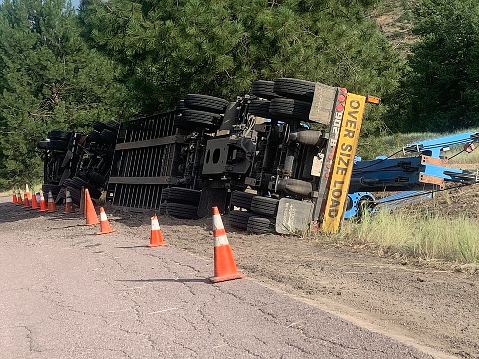 A 98,000-pound semi truck tipped over on Old Highway 10 about a quarter mile west of the Cyr bridge in Alberton. (Courtesy photo)