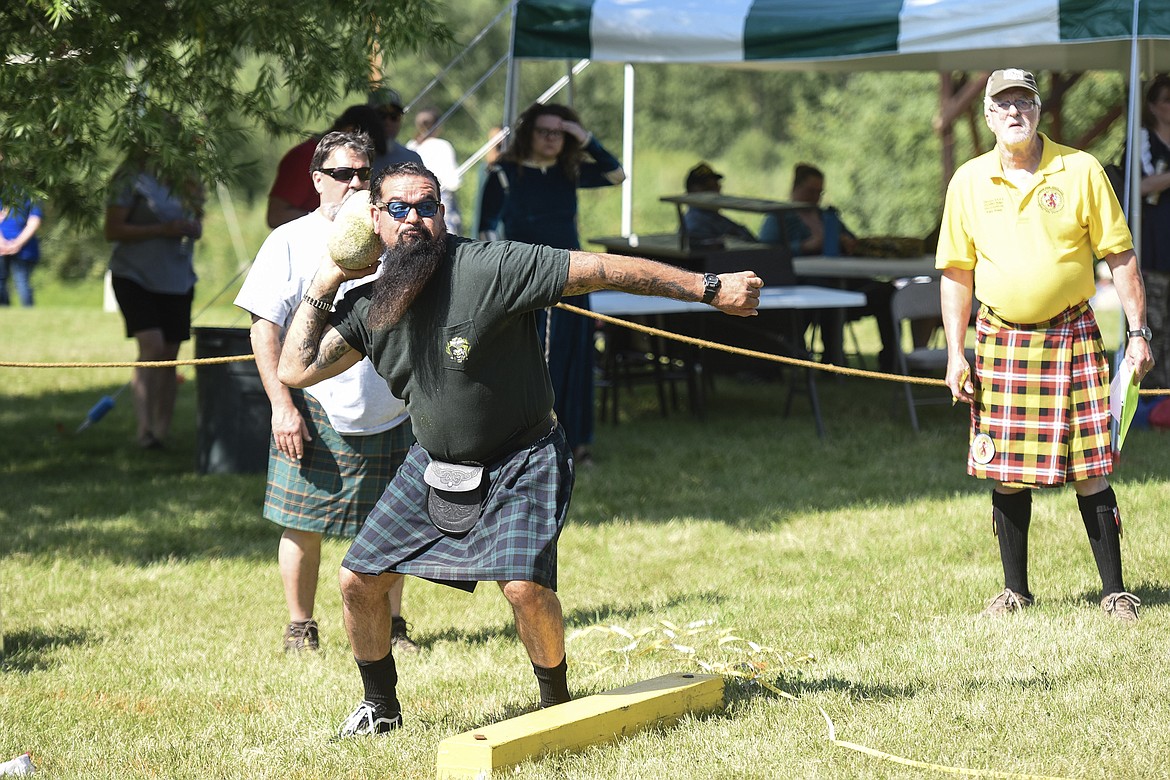 Elvis Alonzo, from Phoenix, Arizona, competes in the Bramer stone competition Saturday at the Kootenai Highland Gathering and Celtic Games. (Ben Kibbey/The Western News)