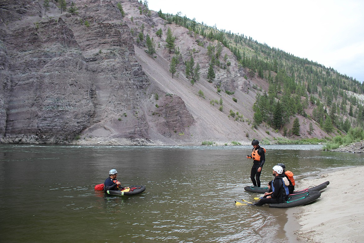 Mike Johnson teaches veterans safety skills before river boarding down the Alberton Gorge. (Maggie Dresser/Mineral Independent)