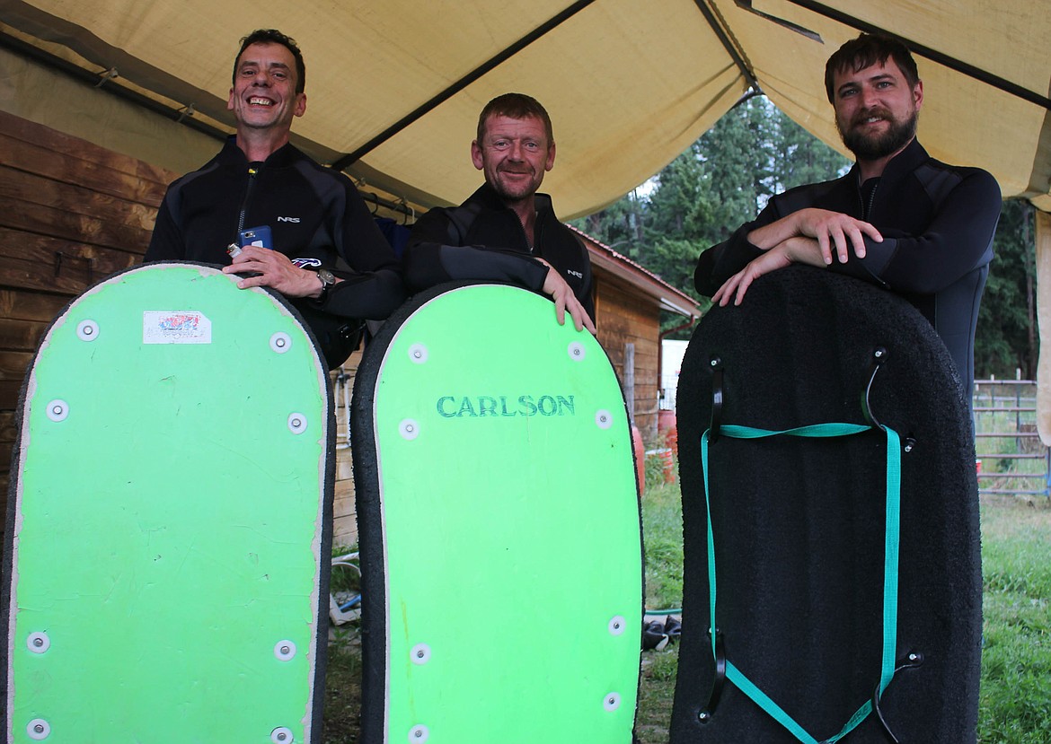 Louis Matteau, Thomas Bond and Anton Johnson gear up at Montana River Guides. (Maggie Dresser/Mineral Independent)