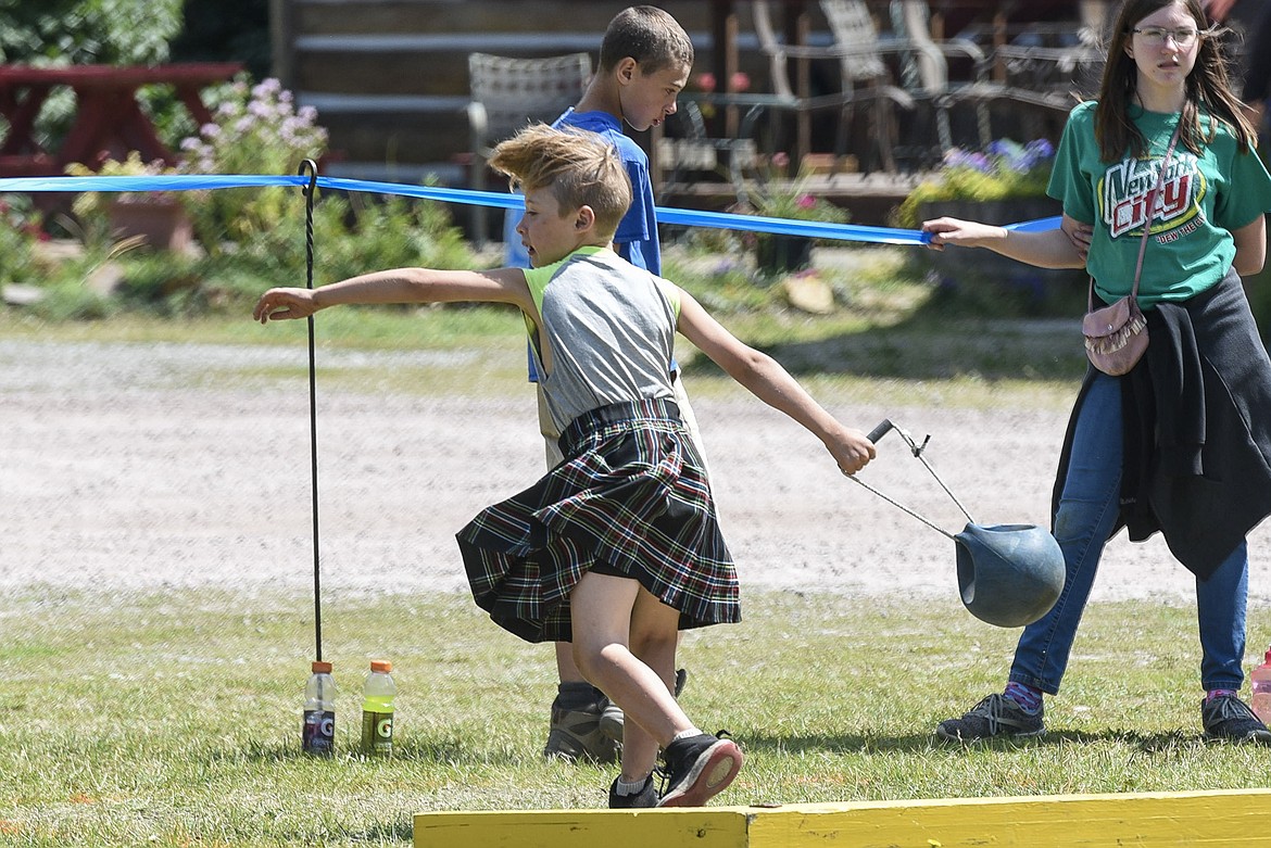 Riley Jones competes in the youth weight-for-distance, Saturday at the Kootenai Highland Gathering and Celtic Games. (Ben Kibbey/The Western News)