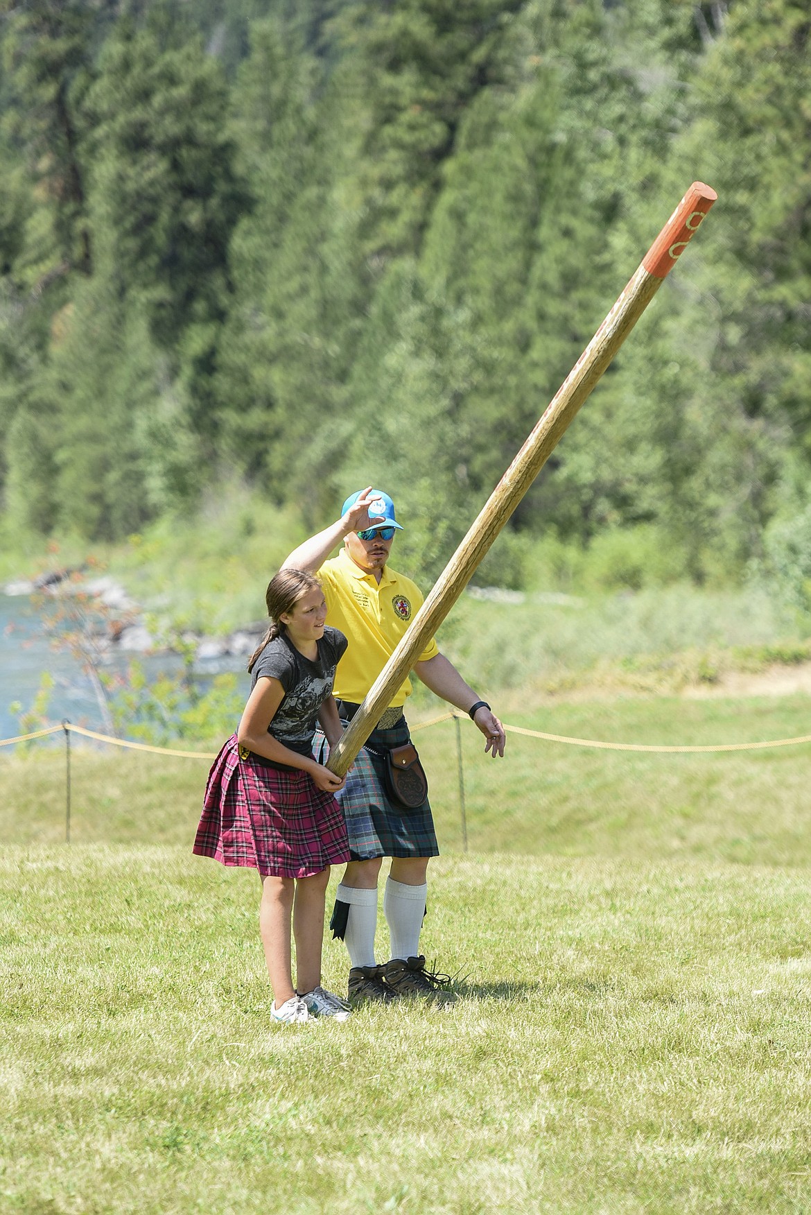 Josie Linger competes in the caber toss, Saturday at the Kootenai Highland Gathering and Celtic Games. (Ben Kibbey/The Western News)