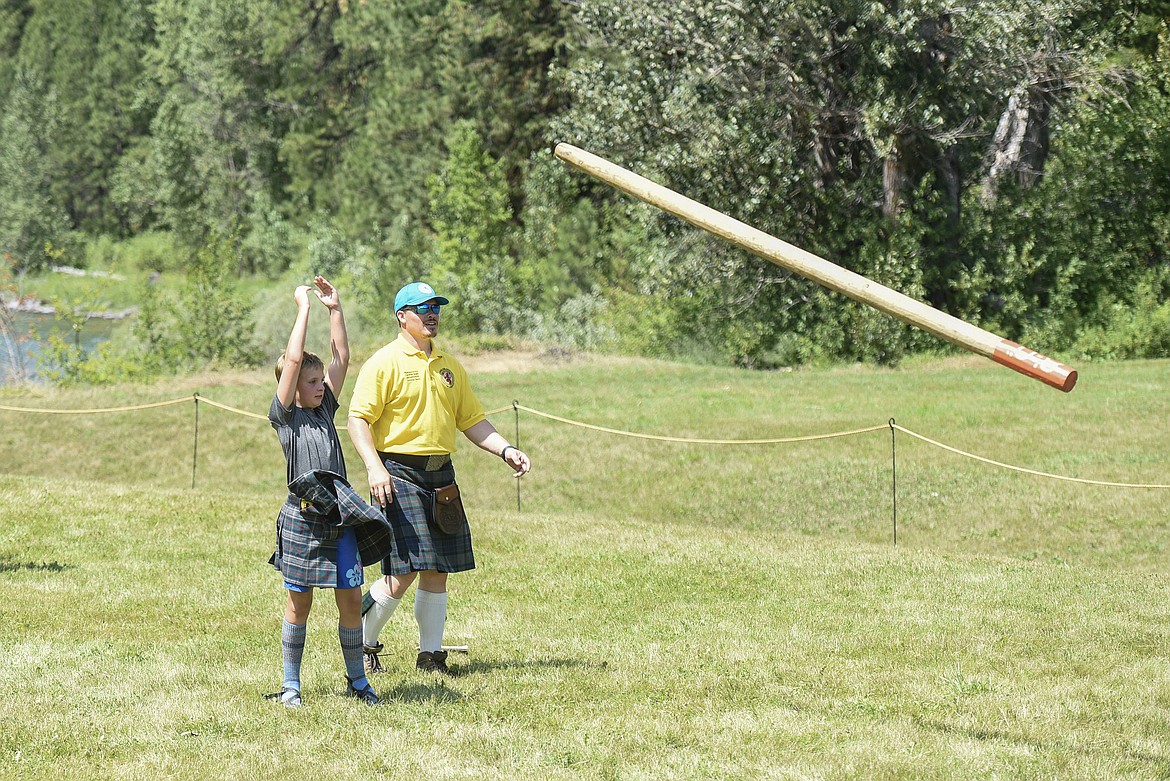 Maya Carlburg competes in the caber toss, Saturday at the Kootenai Highland Gathering and Celtic Games. (Ben Kibbey/The Western News)