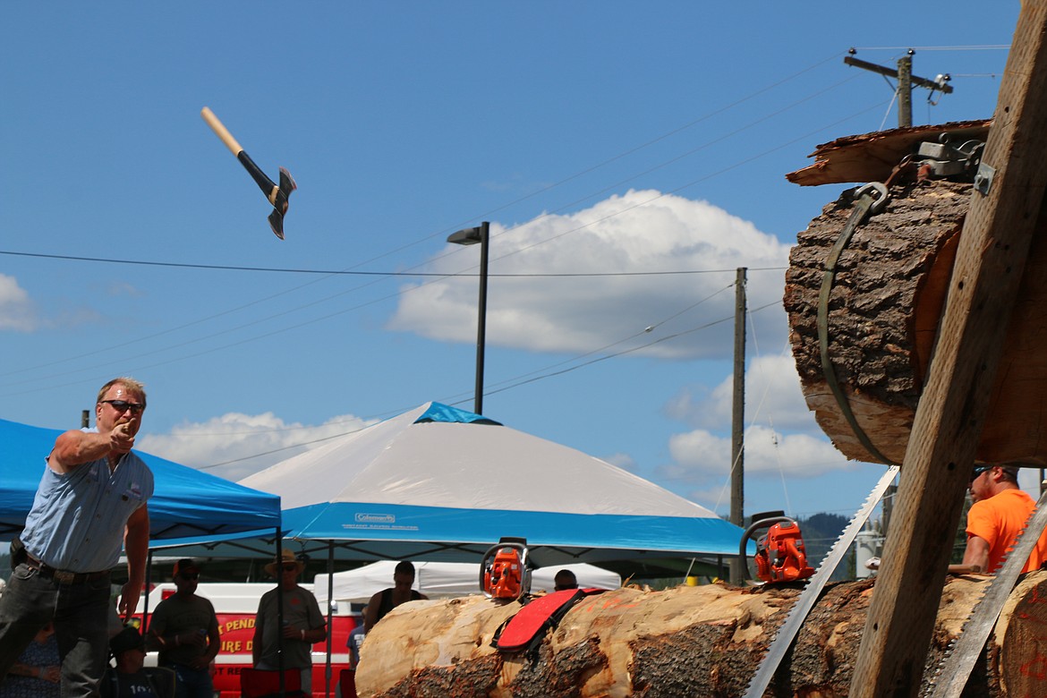 (Photo by CAROLINE LOBSINGER)
A contestant lets his axe fly during Saturday&#146;s Timber Days logging competition.