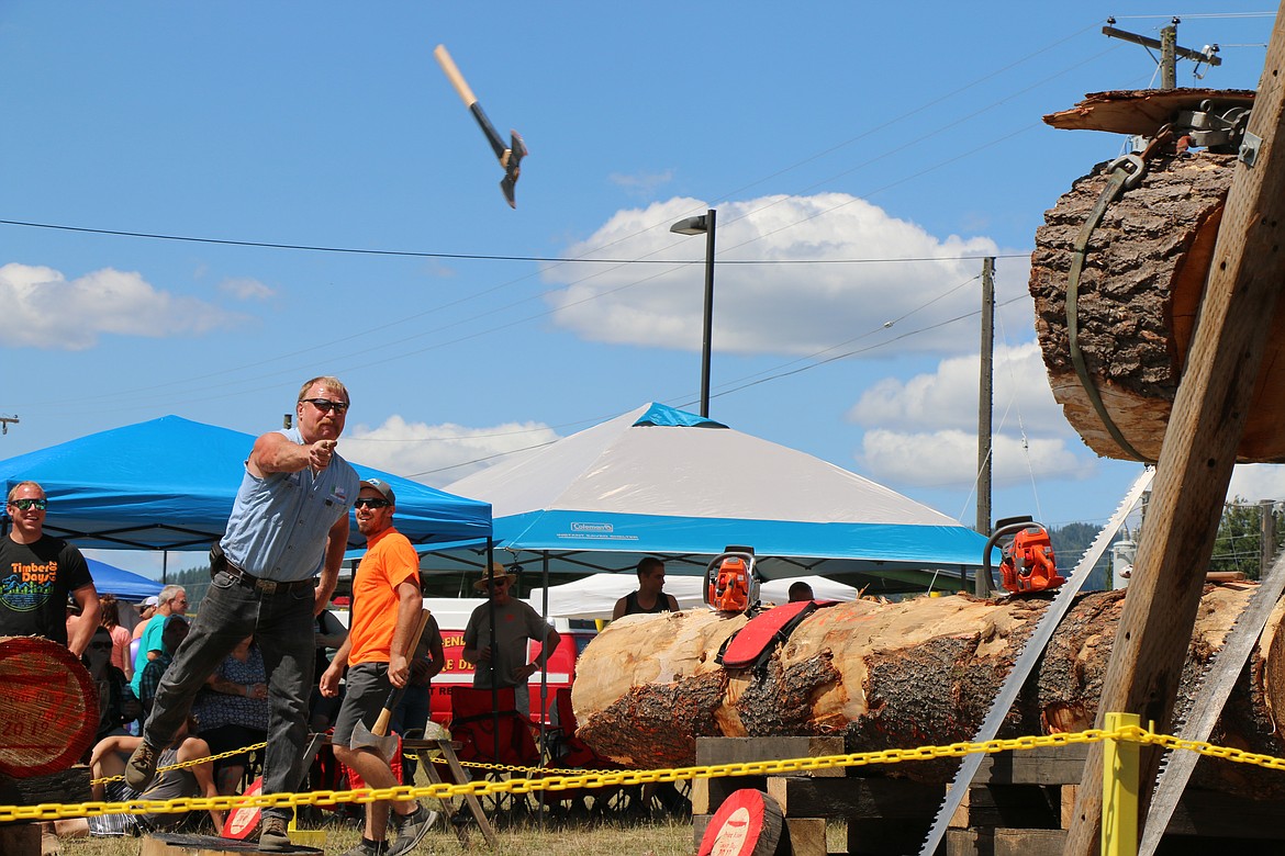 (Photo by CAROLINE LOBSINGER)
A logger throws his axe as he takes part in the annual Priest River Timber Days logging competition.