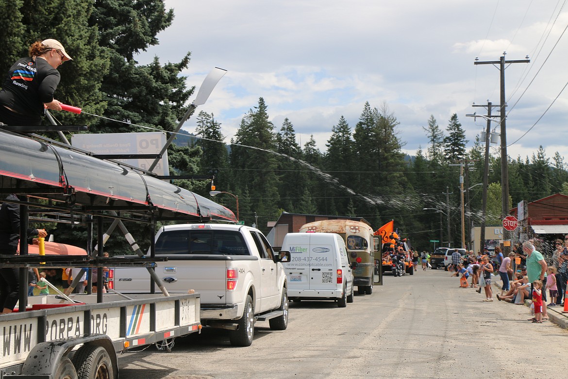 (Photo by CAROLINE LOBSINGER)
A member of the Pend Oreille Rowing and Paddling Association&#146;s aims water at a grateful crowd during the 2019 Priest River Timber Days parade on Saturday.