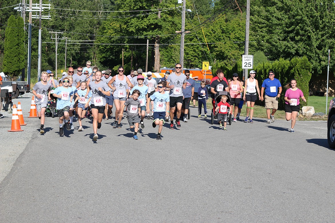 (Photo by MARY MALONE)
Run for the Berries participants begin their 1-mile race in Priest River on Saturday.