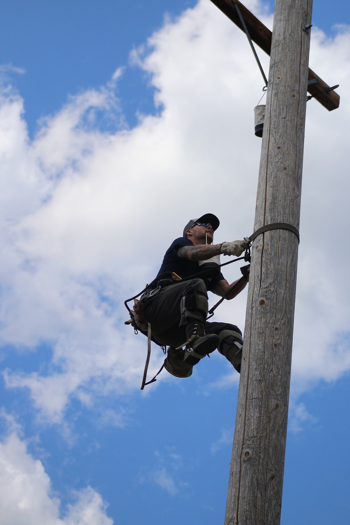 (Photo by CAROLINE LOBSINGER)
A logger holds a basket containing an egg during the Priest River Timber Days timber competition&#146;s pole climbing contest.