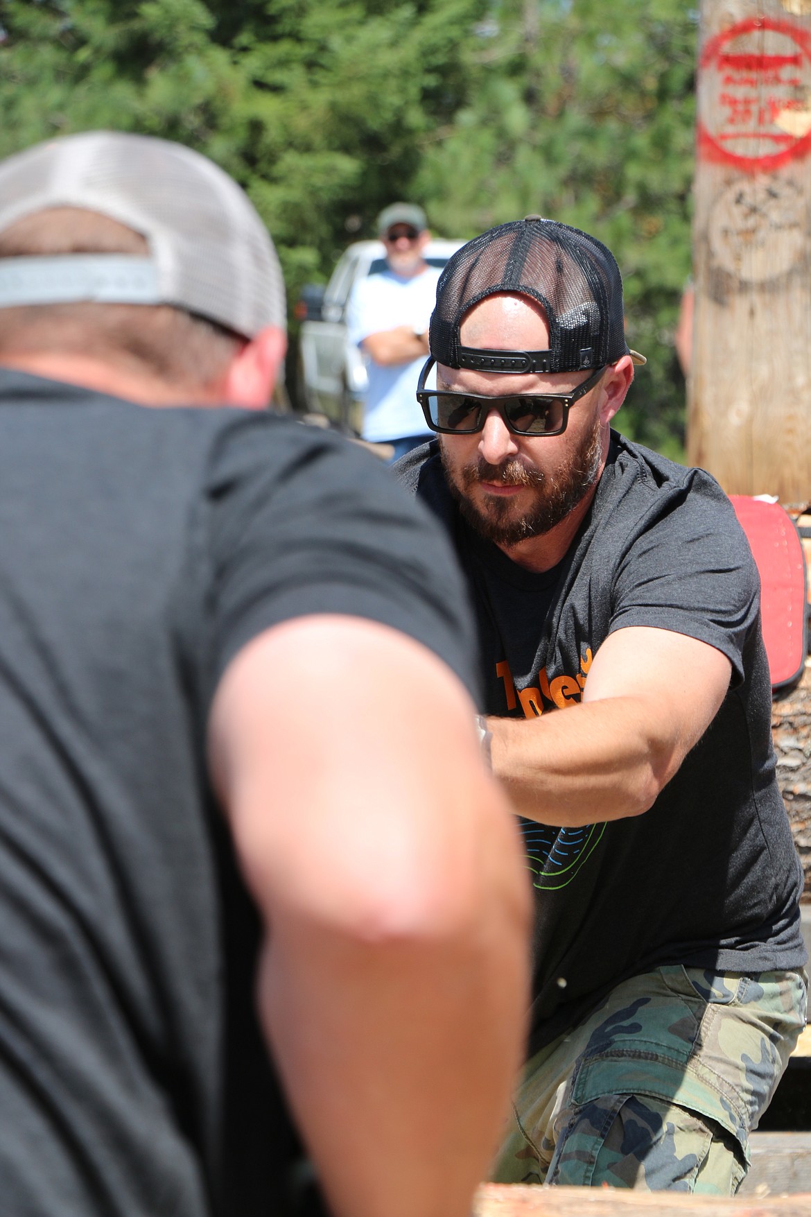 (Photo by CAROLINE LOBSINGER)
Loggers take part in the cross-saw contest held as part of the annual Priest River Timber Days logging competition.