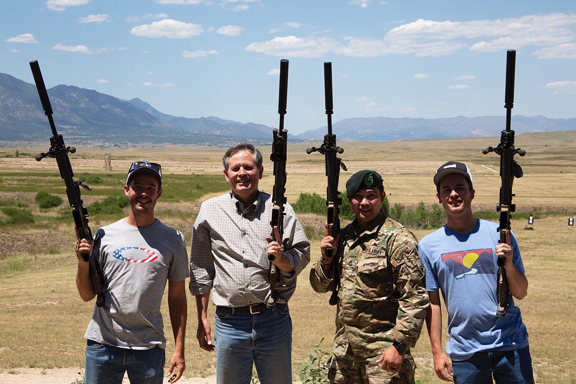 U.S. ARMY Green Beret soldier Brian Sharp poses with Montana Senator Steve Daines and his sons, David and Michael, on the range at the long distance shooting range at the base in Colorado Springs. (Courtesy photo)