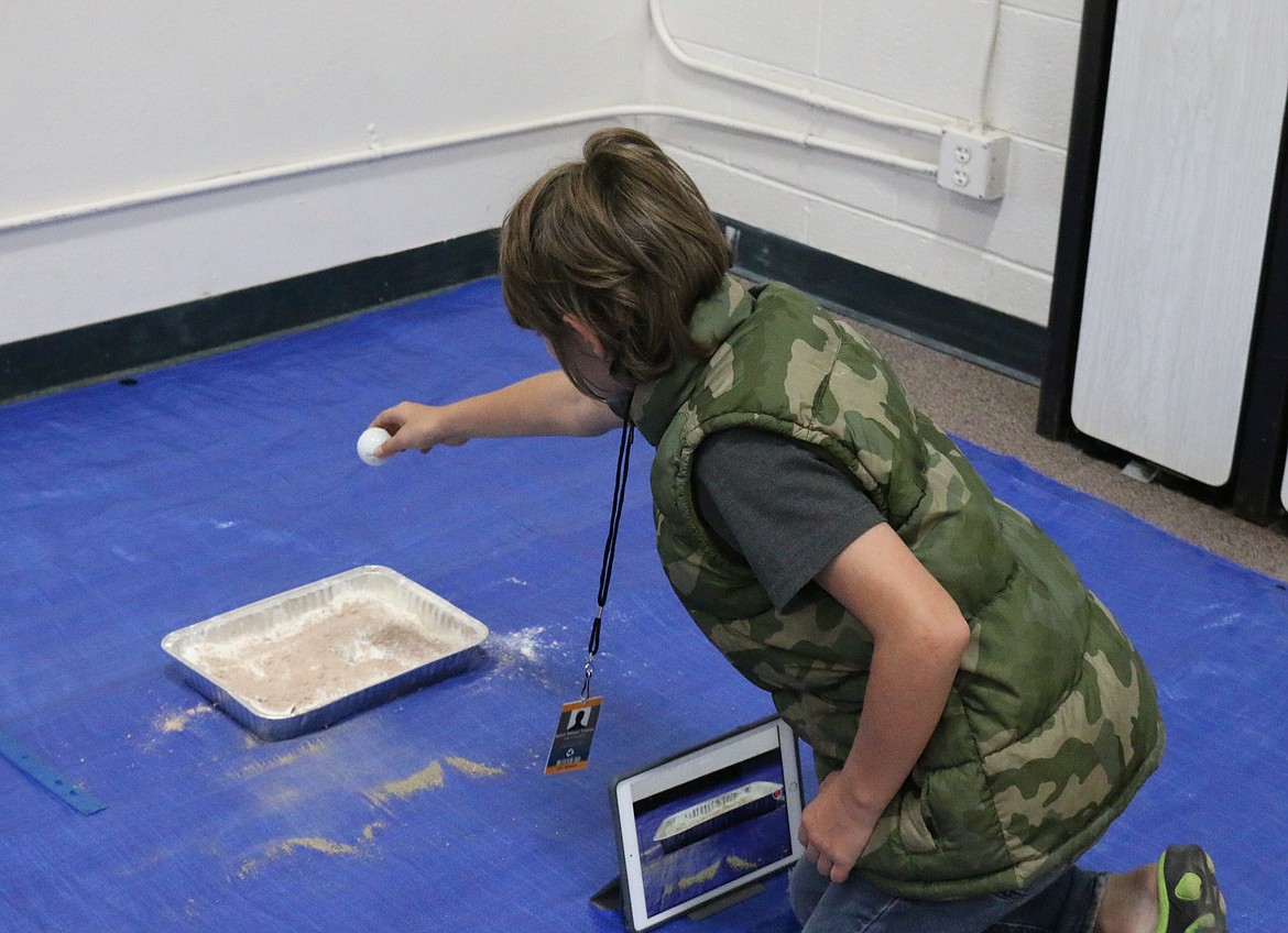 (Photo by MARY MALONE)
&quot;Lunar Craters&quot; was one of five stations where kids enjoyed space-related STEAM activities during Idaho Hill Elementary's Space Ranger Academy on July 18.