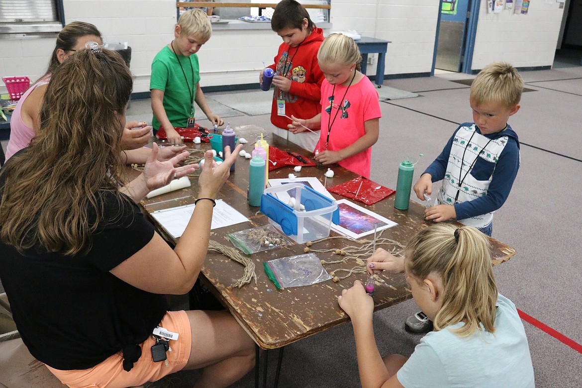 (Photo by MARY MALONE)
Making a &quot;galaxy in a jar&quot; was one the many space-related STEAM activities kids enjoyed during Idaho Hill Elementary's Space Ranger Academy on July 18.