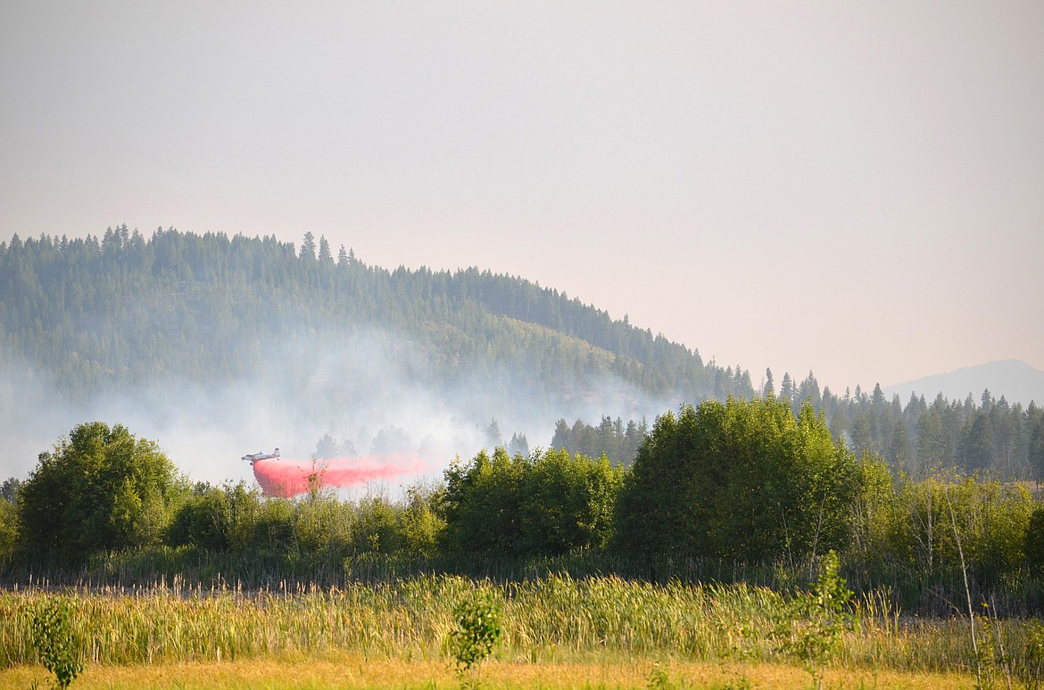 (Photo courtesy IDAHO DEPARTMENT OF LANDS)
A plane drops fire retardant on the Bandy Fire brush fire near Spirit Lake.