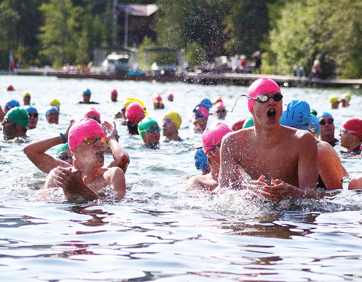 (Photo by KYLE CAJERO)
Sandpoint High School swimmers Hayden Norling (left) and Caleb Norling (right) hype themselves up at the start line of the Long Bridge Swim on Aug. 3.