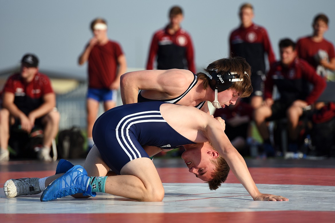 Glacier High School’s Bridger Beach (132 lbs.), top, wrestles Baden-Württemberg’s Nils Krautsieder (130 lbs.) at Legends Stadium on Wednesday. (Casey Kreider/Daily Inter Lake)