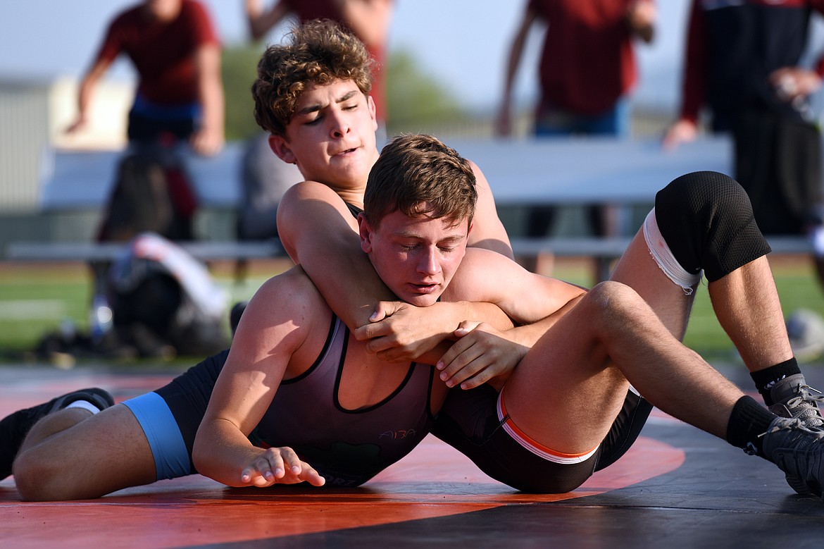 Flathead High School&#146;s Asher Kemppainen (139 lbs.), top, wrestles Baden-W&uuml;rttemberg&#146;s Paul Niemann (132 lbs.) in a Greco-Roman rules match at Legends Stadium on Wednesday. (Casey Kreider/Daily Inter Lake)