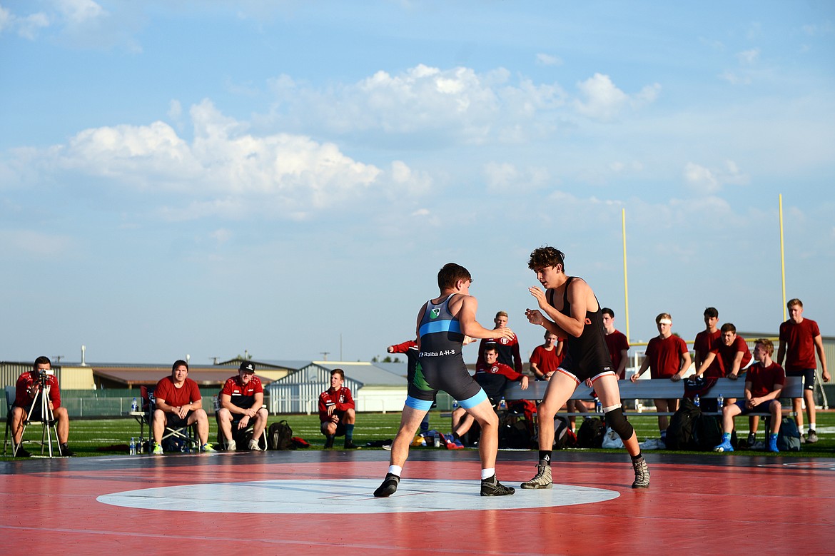 Flathead High School&#146;s Asher Kemppainen (139 lbs.), right, prepares to tie up with Baden-W&uuml;rttemberg&#146;s Paul Niemann (132 lbs.) in a Greco-Roman rules match at Legends Stadium on Wednesday. (Casey Kreider/Daily Inter Lake)