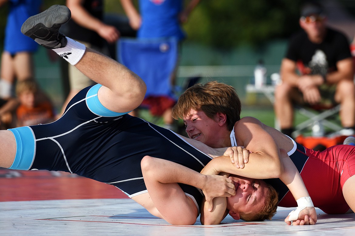 Columbia Falls High School&#146;s Justin Windauer (118 lbs.), right, wrestles Baden-W&uuml;rttemberg&#146;s Jonas Stark (113 lbs.) at Legends Stadium on Wednesday. (Casey Kreider/Daily Inter Lake)