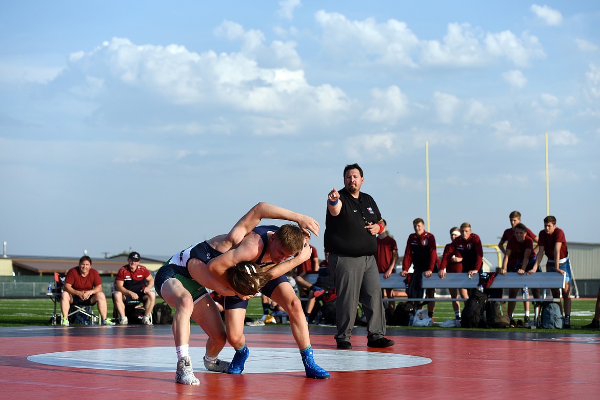 Glacier High School&#146;s Bridger Beach (132 lbs.), left, ties up with Baden-W&uuml;rttemberg&#146;s Nils Krautsieder (130 lbs.) at Legends Stadium on Wednesday. (Casey Kreider/Daily Inter Lake)