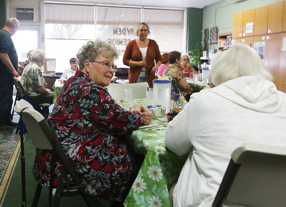 Hayden resident Darlene Willhite, left, 81, and Kathlyn Thrasher, 83, of Coeur d'Alene chat before lunch at Hayden Senior Center on June 27, 2019. (LOREN BENOIT/Press)