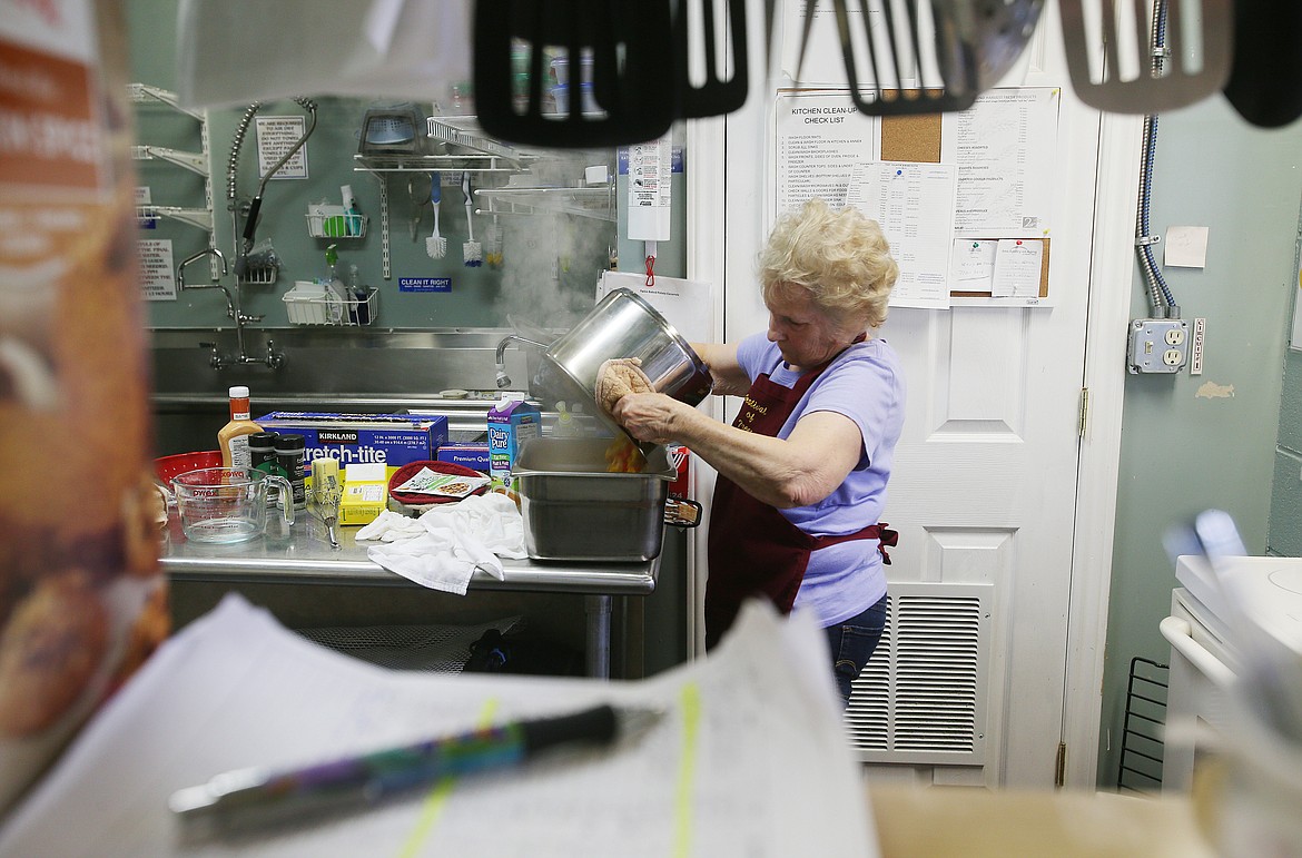 Volunteer Becky Phillips prepares mashed potatoes for lunch June 27, 2019 at Hayden Senior Center. (LOREN BENOIT/Press)