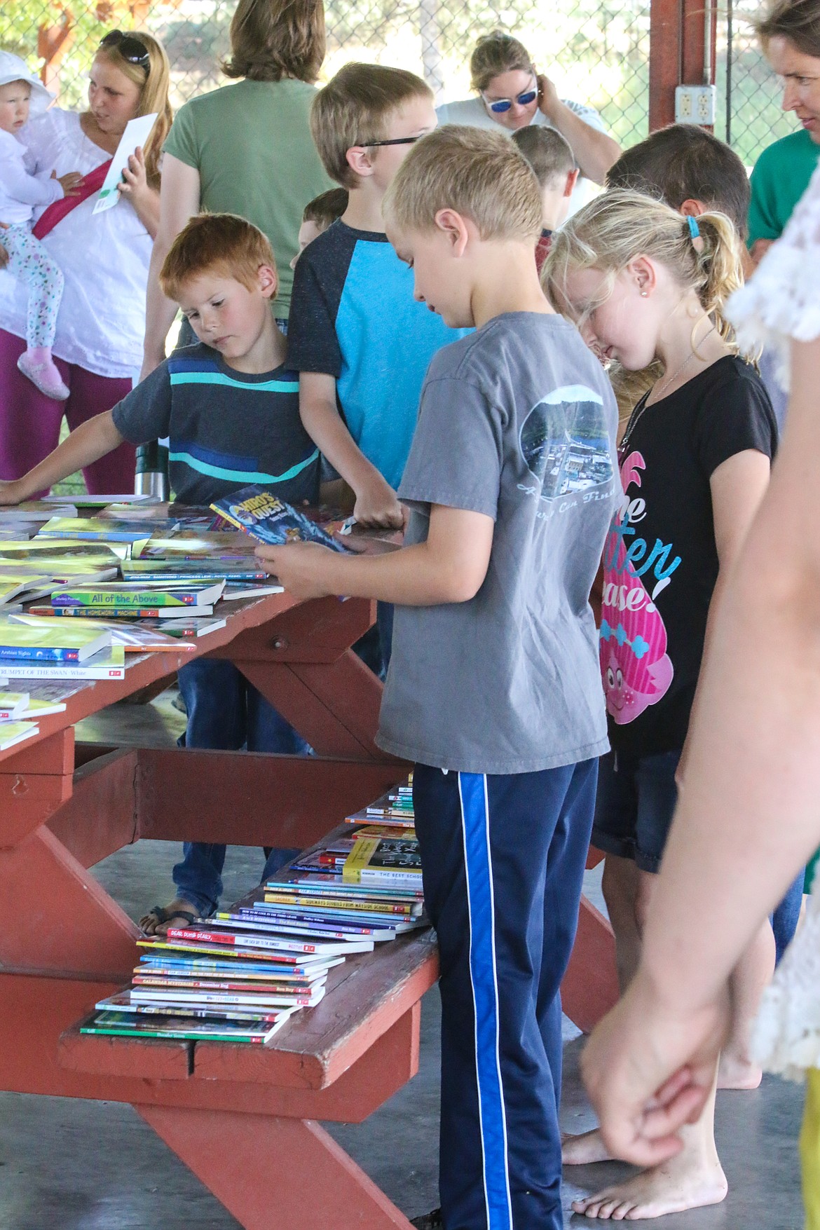 Photo by MANDI BATEMAN
There were books for all ages, displayed across picnic tables, for the children to choose from.