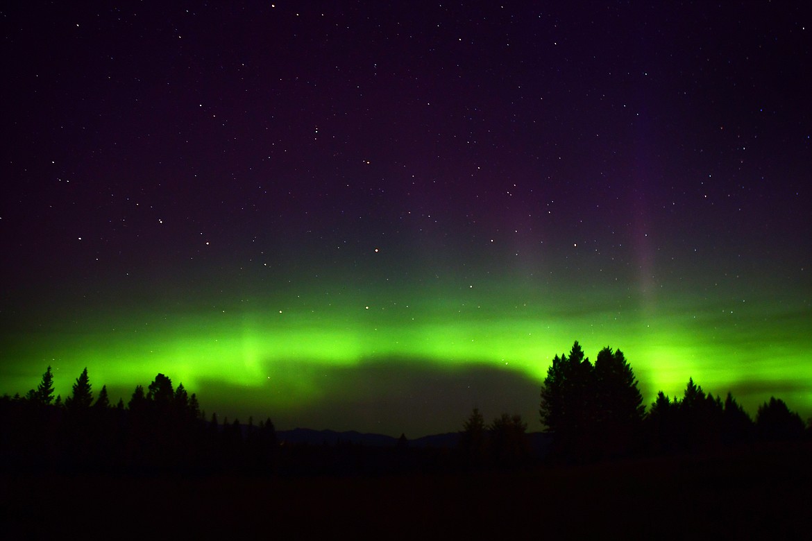 The aurora begins to light up the mountains north of Columbia Falls around 2:30 a.m. Monday. (Jeremy Weber photo)