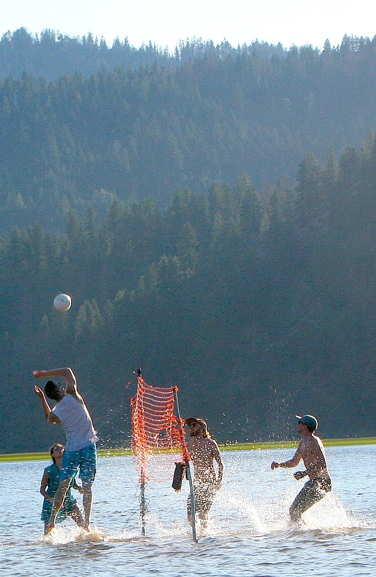 A group enjoys a cool game of volleyball on Killarney Lake on July 20. More sunny weather with highs in the upper 80s to lower 90s are predicted this weekend. (BRIAN WALKER/Press)