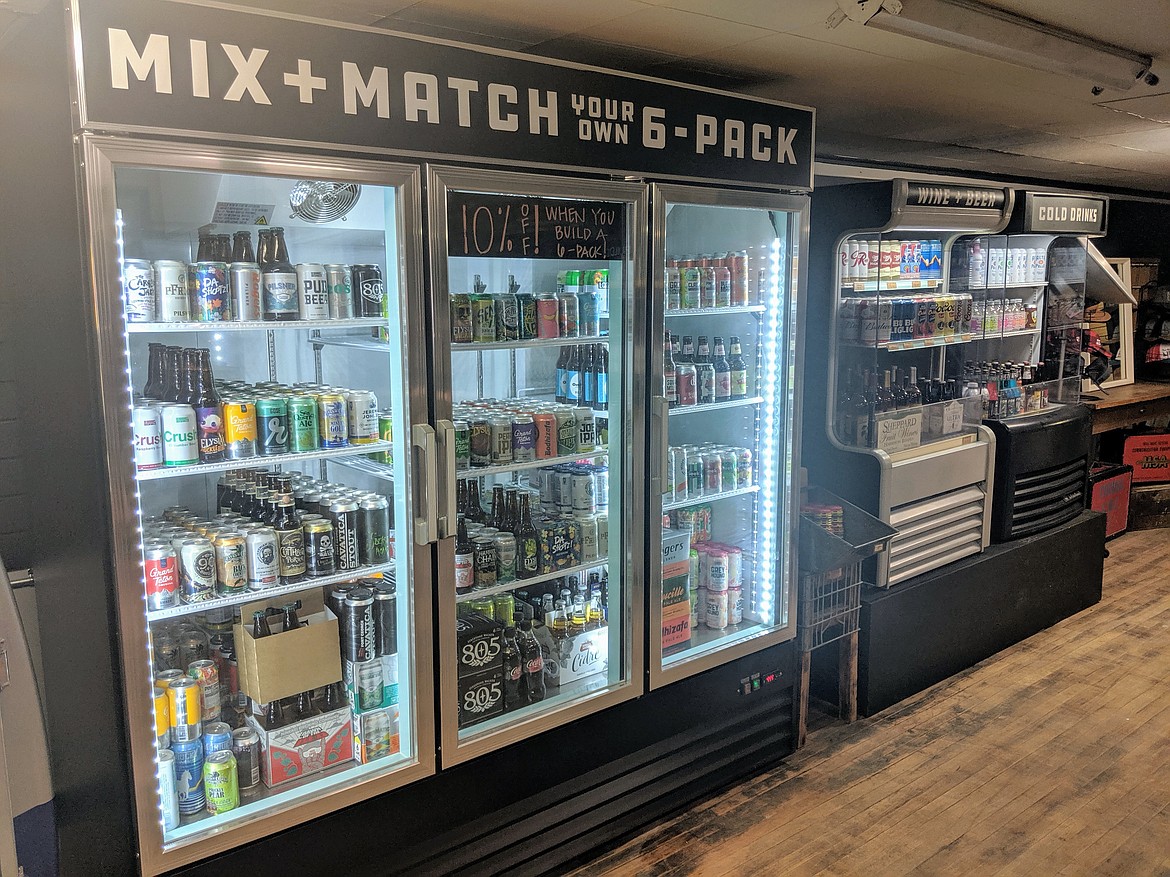 The beer cooler inside Oliver&#146;s Mercantile that boasts a stock of 75 different beverages. Customers are encouraged to create their own six-pack and try a variety of different beer at home.