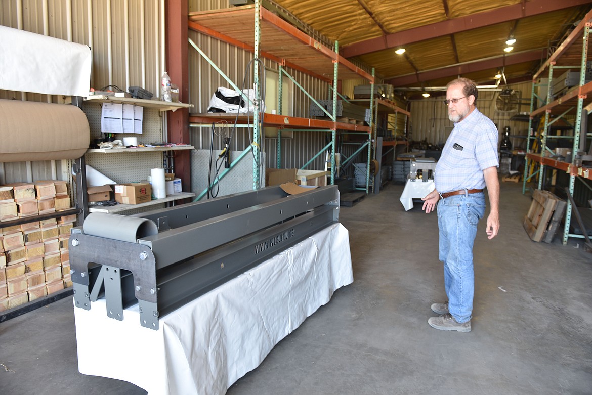 DON WOODS of Montana Solar said they &quot;Wwecall ourselves the IKEA of solar installation.&quot; The company manufactures one specialty part, but includes it with a full mounting frame package, including bolts, if the customer needs it. (photo by Carolyn Hidy/Lake County Leader)