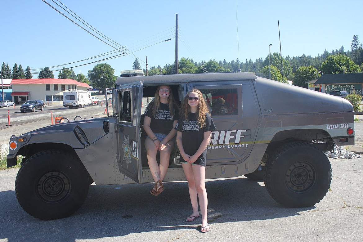 Photo by TANNA YEOUMANS
Bailey and Hope Jenkins pose the BCSO Humvee during the Battle Grounds one year anniversary and law enforcement appreciation day.