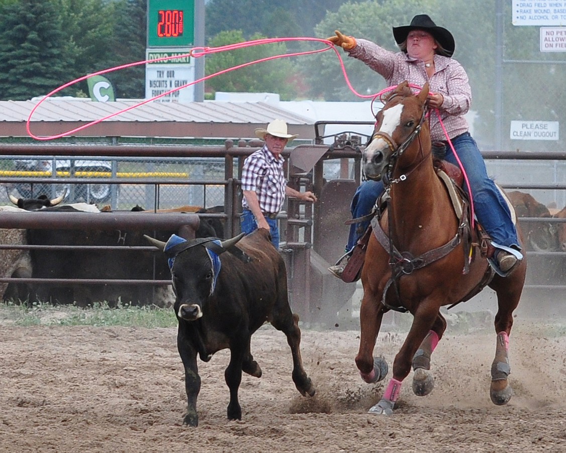 Hallie Sohr, the lone cowgirl in the Ranch Rodeo competition throws a loop around a roping steer.