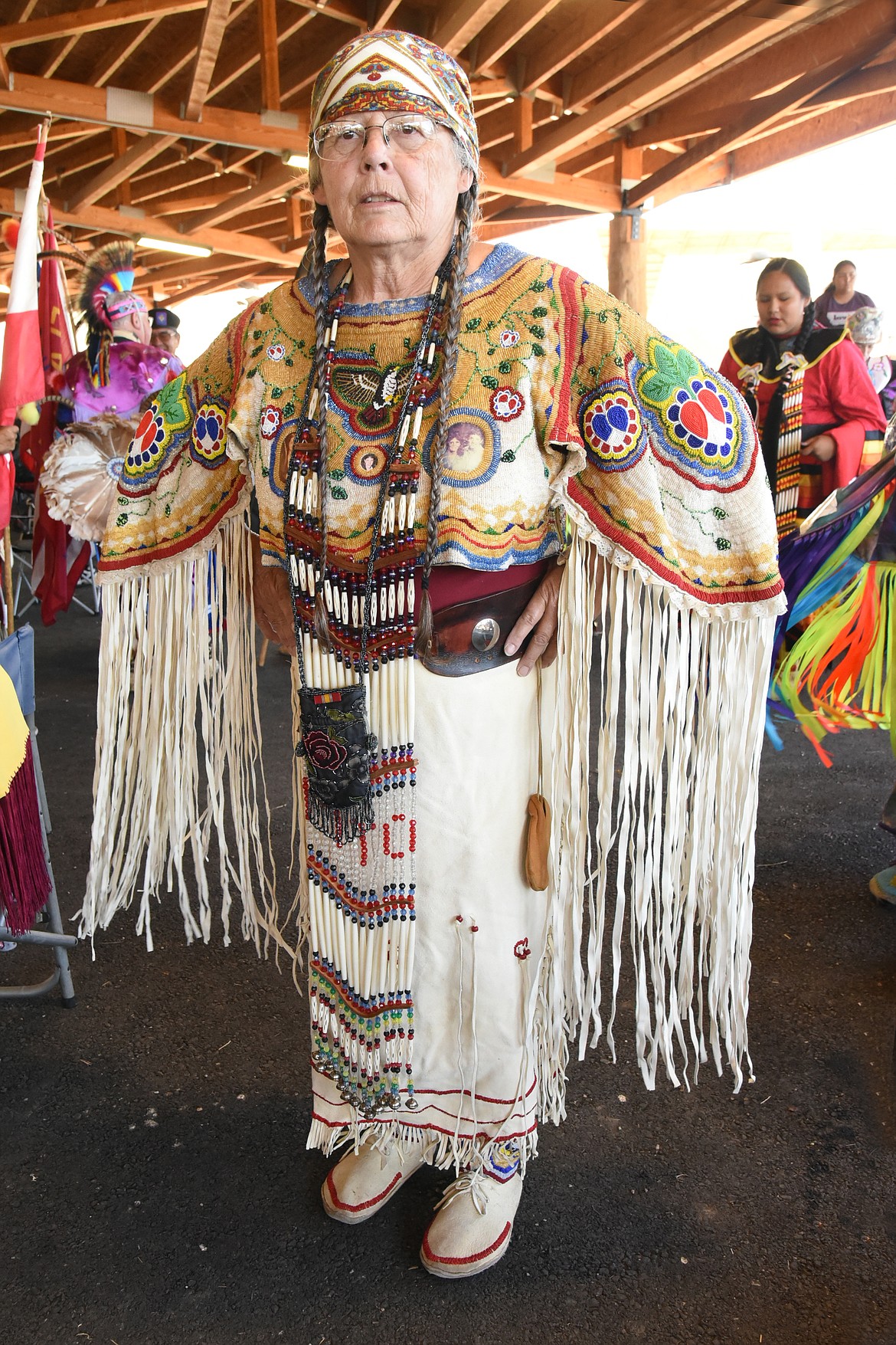 Bobby Orr of Polson wears a dress that she beaded herself over the course of many years. Over her heart is a picture of her with her son. He is deceased, but she carries him with her as she dances at the Standing Arrow Powwow Celebration.