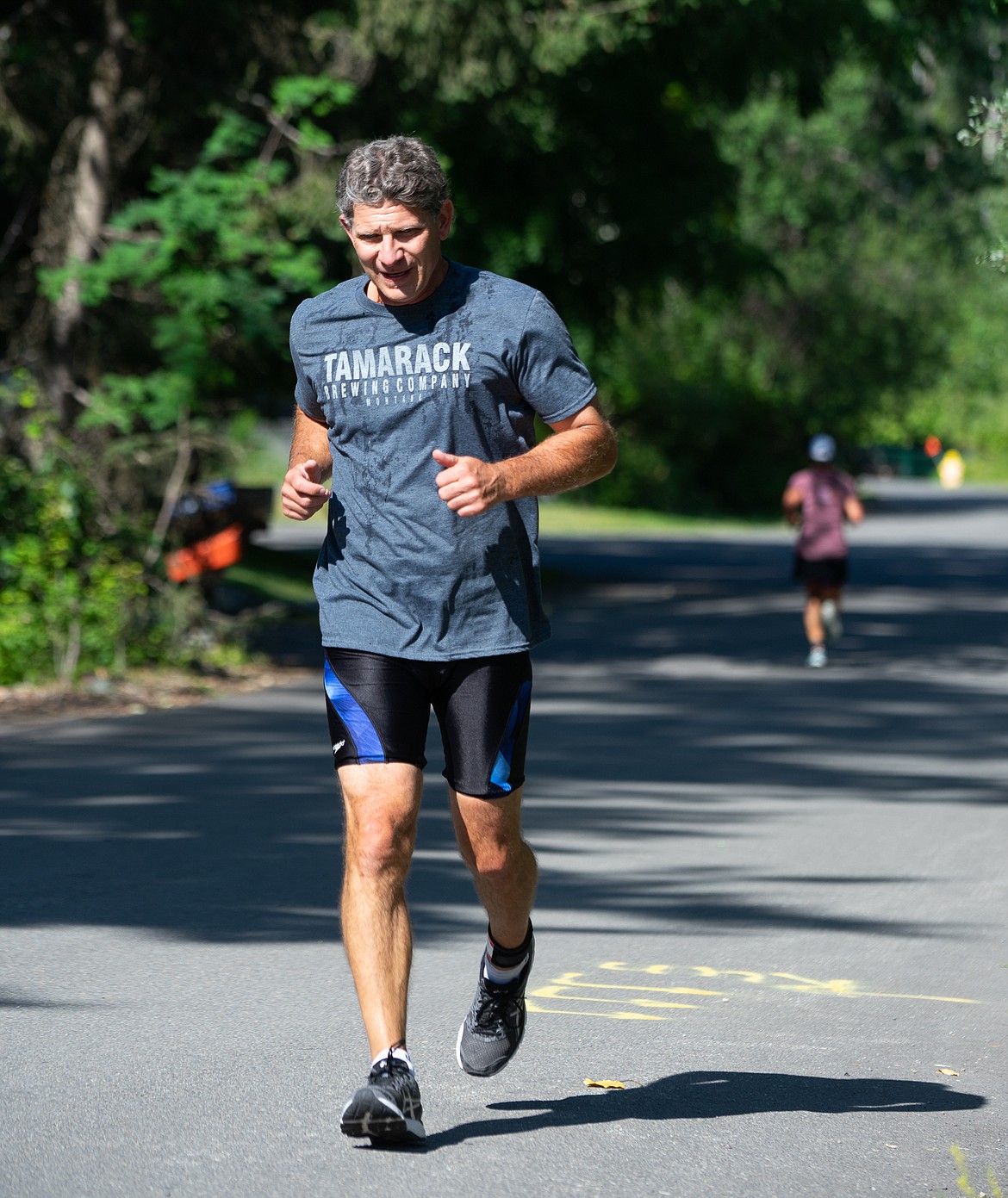 A runner comes to the end of Glenwood Road during the Whitefish Lake Triathlon on Sunday. (Daniel McKay/Whitefish Pilot)