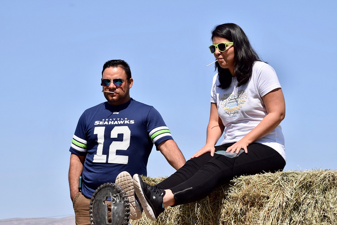 Charles H. Featherstone/Sun Tribune
Eric Perez and Brisa Sanchez during the hot sucker contest.