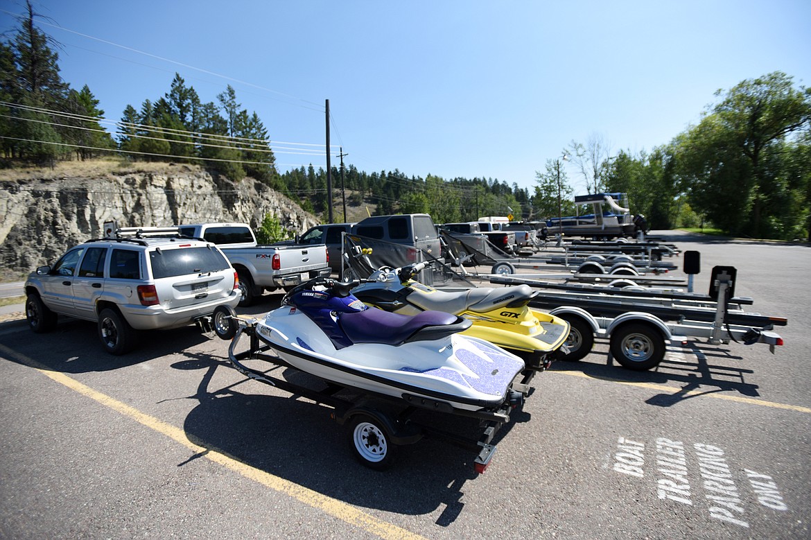 Trailers, boats and personal watercraft on one side of the parking lot at the Somers Bay boat launch on Tuesday, July 30. (Casey Kreider/Daily Inter Lake)