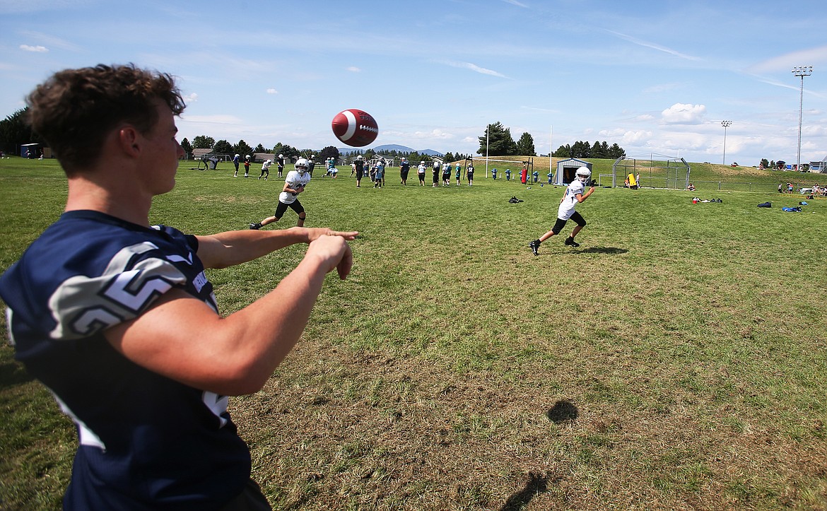 Porter Howard, a junior at Lake City High School, helps a middle school student with his defensive back skills Friday at Lake City&#146;s Junior Tackle camp.