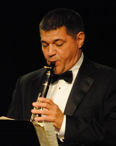 Geoffrey Flolo is a 20-year veteran of the presidential United States Navy Band and has served as section clarinetist, soloist and principal.