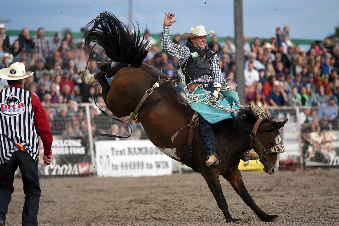 Tanner Aus, from Granite Falls, Minn., holds on to his horse After All during bareback riding at the Northwest Montana Fair PRCA Rodeo at the Flathead County Fairgrounds on Friday. (Casey Kreider/Daily Inter Lake)