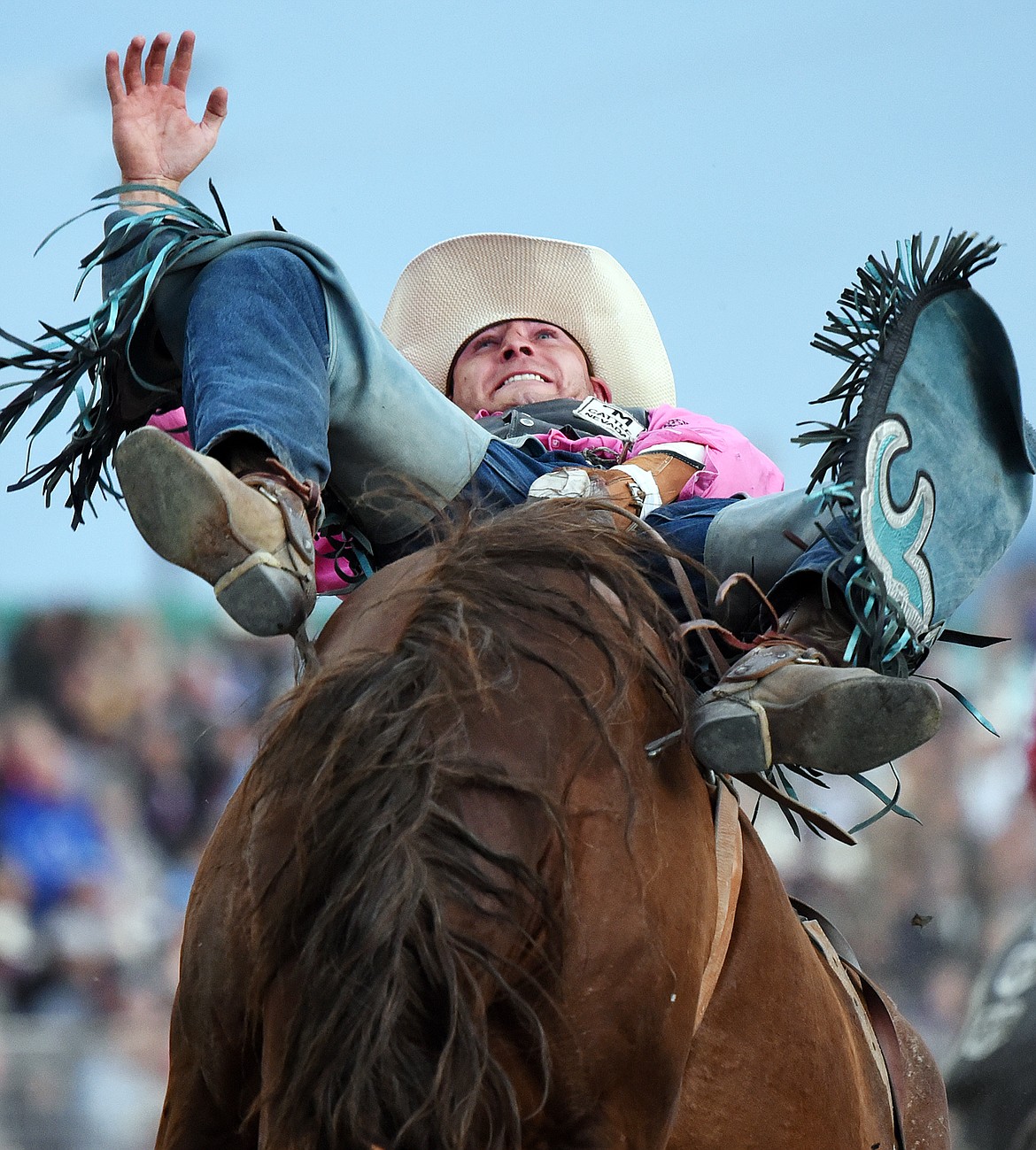 Trenten Montero, from Winnemucca, Nev., holds on to his horse Double Dippin' during bareback riding at the Northwest Montana Fair PRCA Rodeo at the Flathead County Fairgrounds on Friday. (Casey Kreider/Daily Inter Lake)