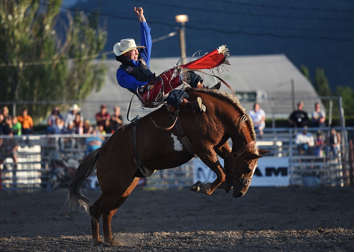 Blade Elliott holds on to his horse Illegal Smile in bareback riding at the Ram PRCA Rodeo at the Northwest Montana Fair &amp; Rodeo on Thursday. (Casey Kreider/Daily Inter Lake)