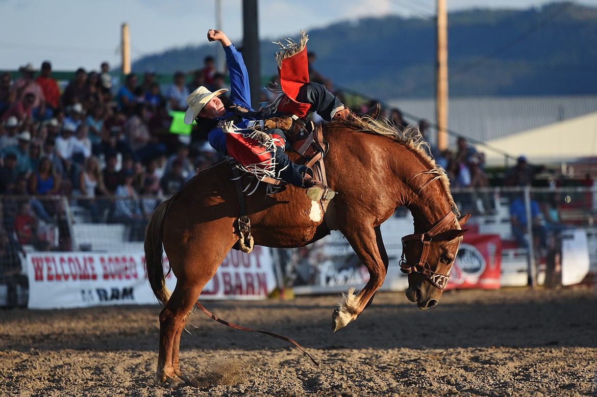 Blade Elliott holds on to his horse Illegal Smile in bareback riding at the Ram PRCA Rodeo at the Northwest Montana Fair &amp; Rodeo on Thursday. (Casey Kreider/Daily Inter Lake)